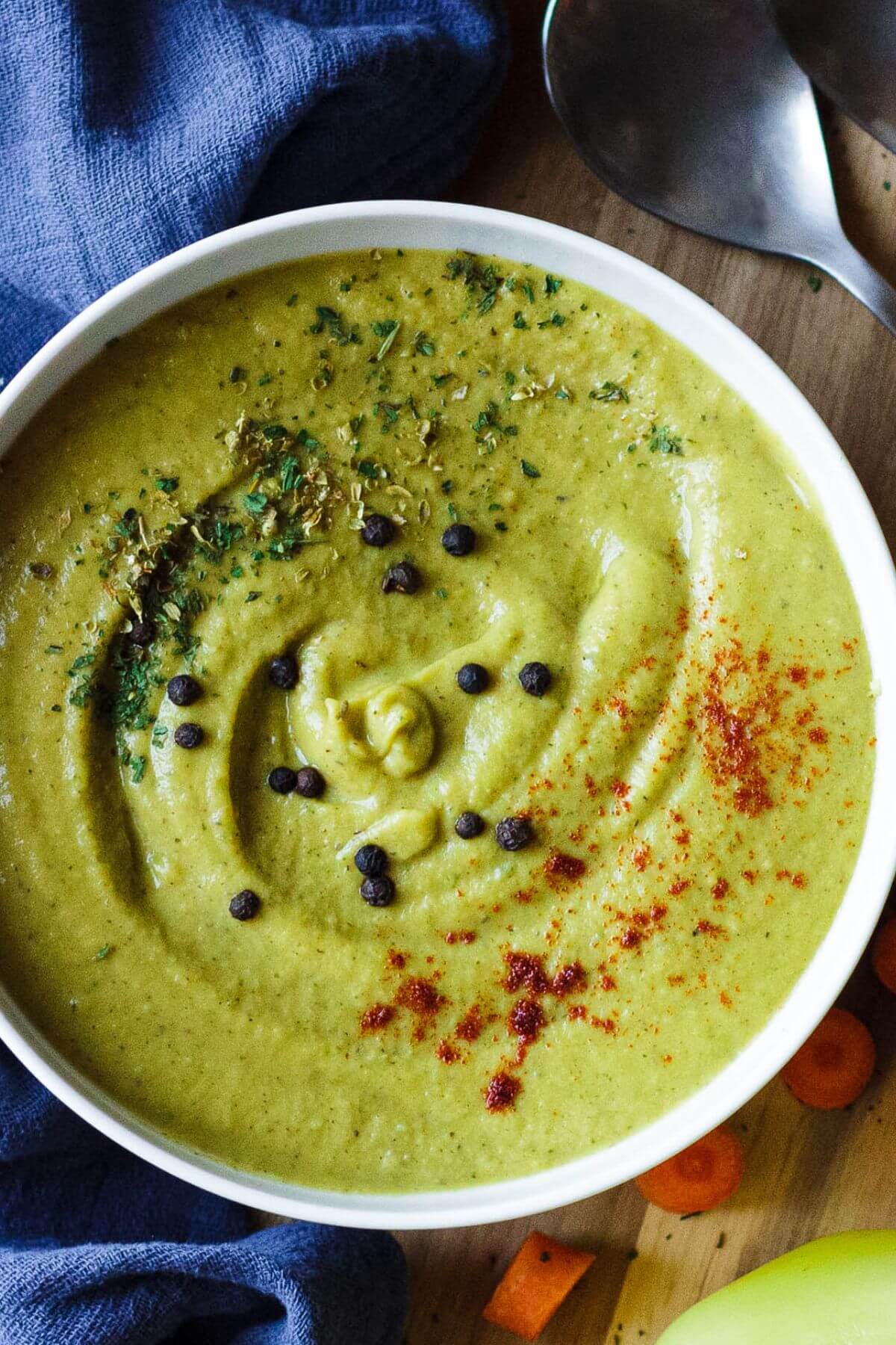 Bowl of Cream of Green Vegetable Soup with spice garnishes